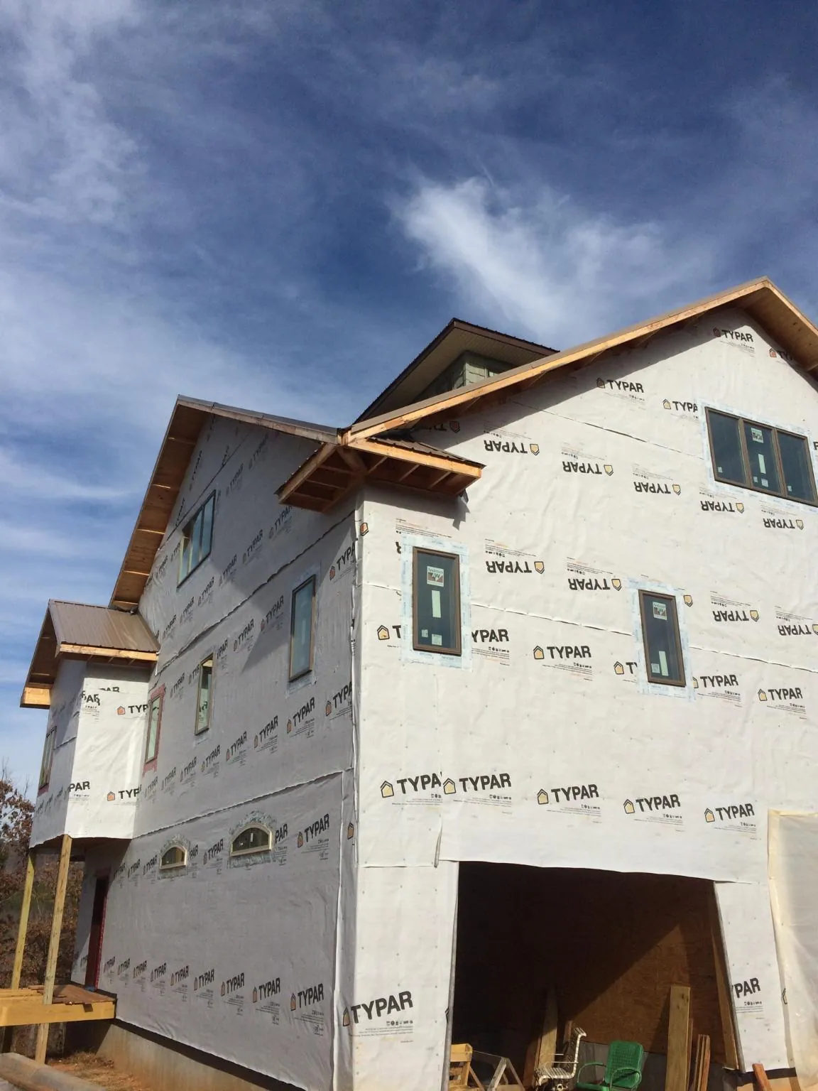 Stick built house wrapped in Typar with new roof framing and dormers in Ashville